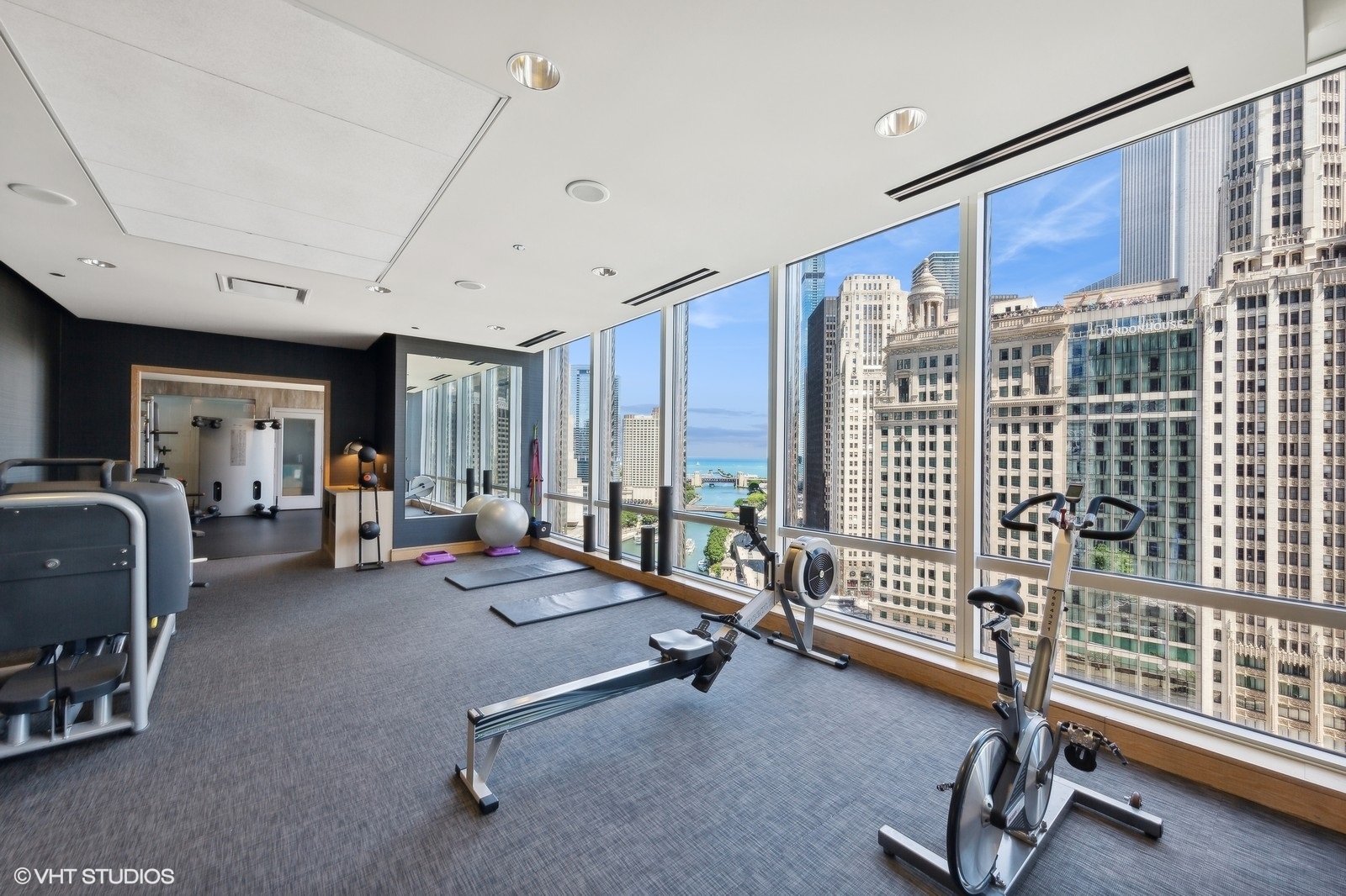 401 North Wabash Avenue, Unit 1936 Chicago, IL 60611 - Photo 15 of 19 a room with gym equipment and large window