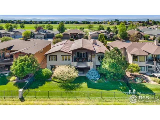 a view of houses with outdoor space and ocean view