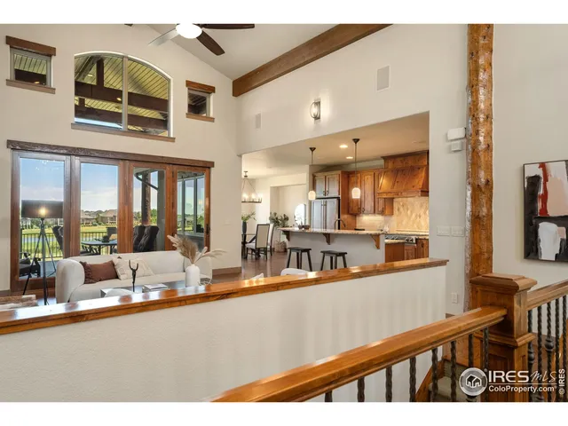 a spacious bedroom with a bed and a potted plant