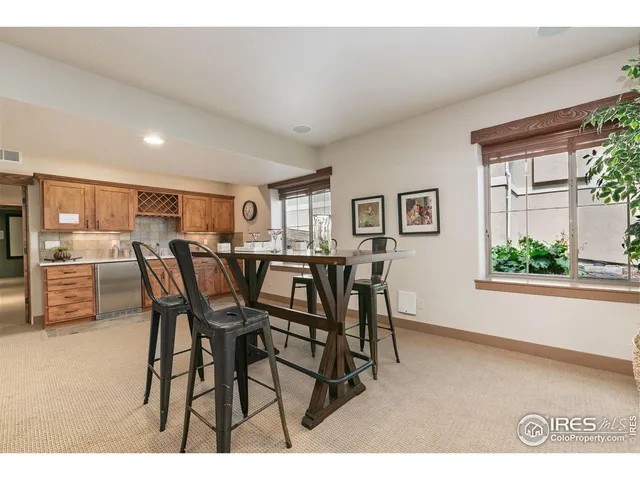 a kitchen with granite countertop cabinets a sink and a wooden floors
