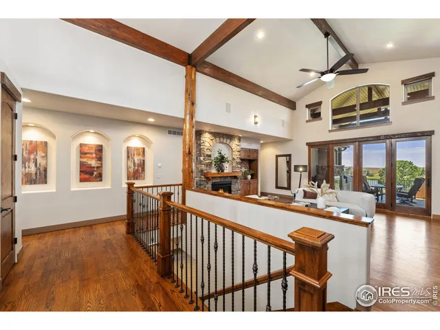 a dining room with furniture and a floor to ceiling window