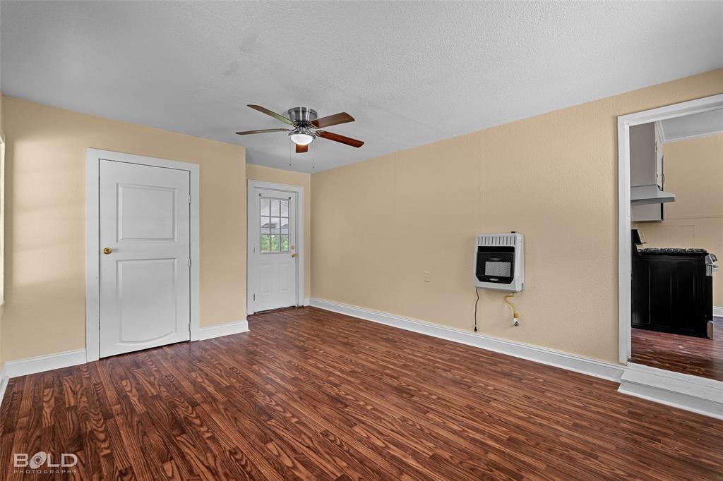 115 Pam Street Mansfield, LA 71052 - Photo 13 of 25 a view of an empty room with a window and wooden floor