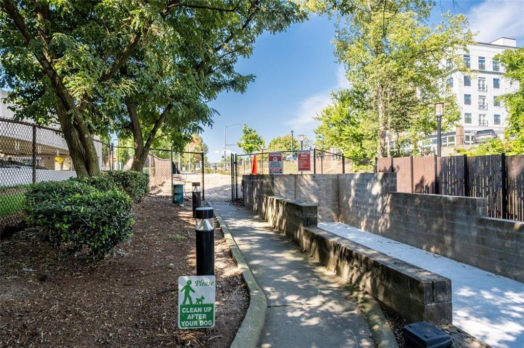 5200 Peachtree Road, Unit 2114 Chamblee, GA 30341 - Photo 15 of 26 a view of a patio with chairs and a large tree