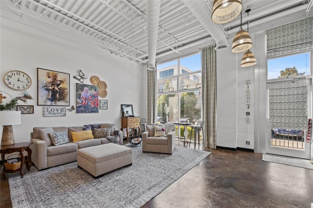 5200 Peachtree Road, Unit 2114 Chamblee, GA 30341 - Photo 17 of 26 a living room with furniture and a window