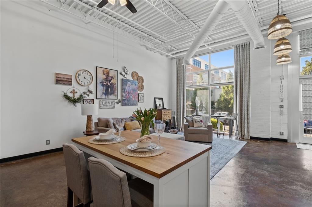 5200 Peachtree Road, Unit 2114 Chamblee, GA 30341 - Photo 19 of 26 a view of a dining room with furniture and window