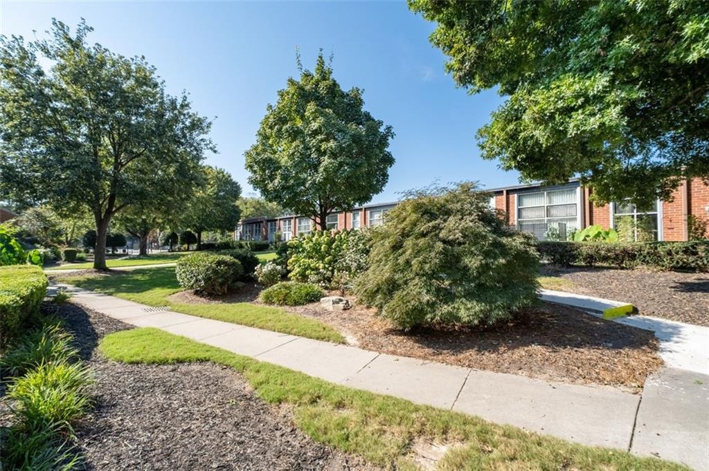 5200 Peachtree Road, Unit 2114 Chamblee, GA 30341 - Photo 24 of 26 a view of a garden with a fountain