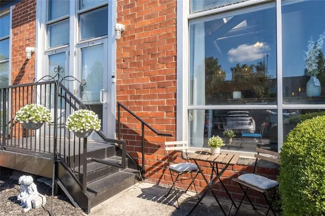a view of a chairs and table in patio