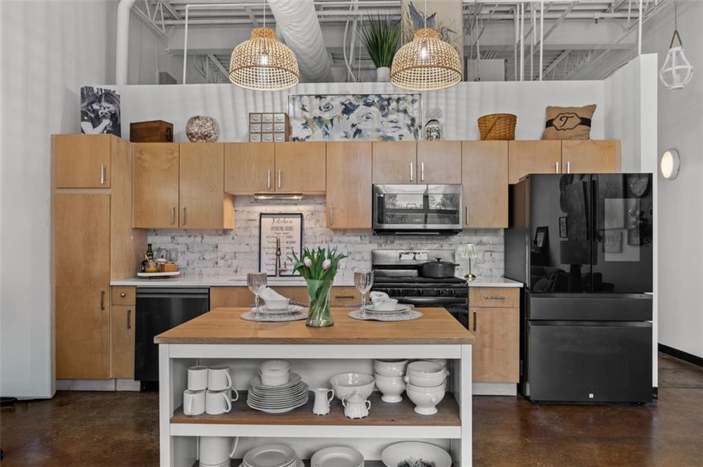 5200 Peachtree Road, Unit 2114 Chamblee, GA 30341 - Photo 5 of 26 a kitchen with stainless steel appliances granite countertop a refrigerator and stove