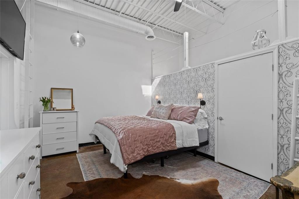 5200 Peachtree Road, Unit 2114 Chamblee, GA 30341 - Photo 10 of 26 a bedroom with a bed and a desk