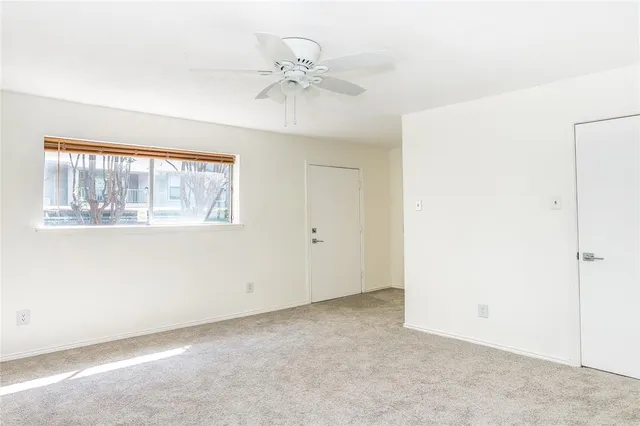 a view of an empty room with a window