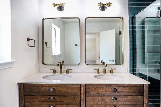 a bathroom with a sink double vanity and a mirror
