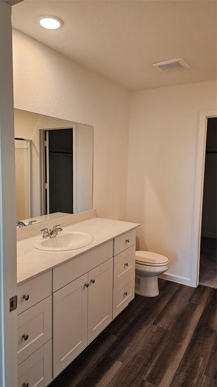 2102 Prairie Lane Melissa, TX 75454 - Photo 13 of 32 a bathroom with a toilet sink and mirror