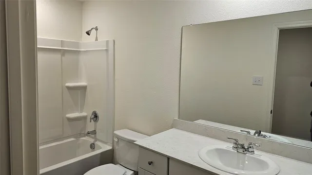 a bathroom with a toilet and a bathtub