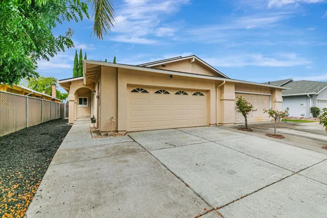 a view of garage and small yard