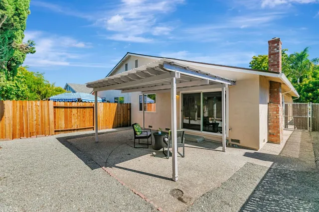 a backyard of a house with seating space