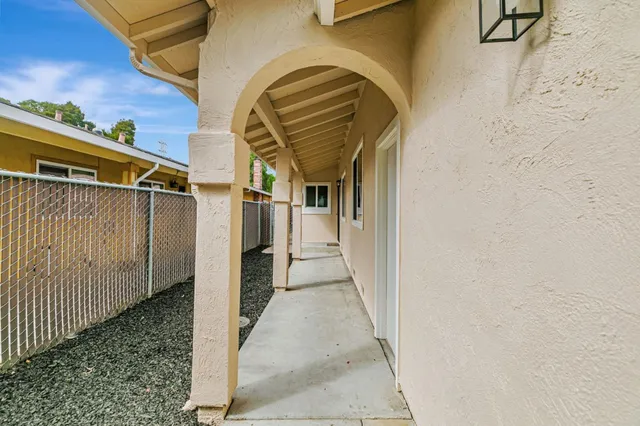 a view of a hallway with wooden walls and stairs