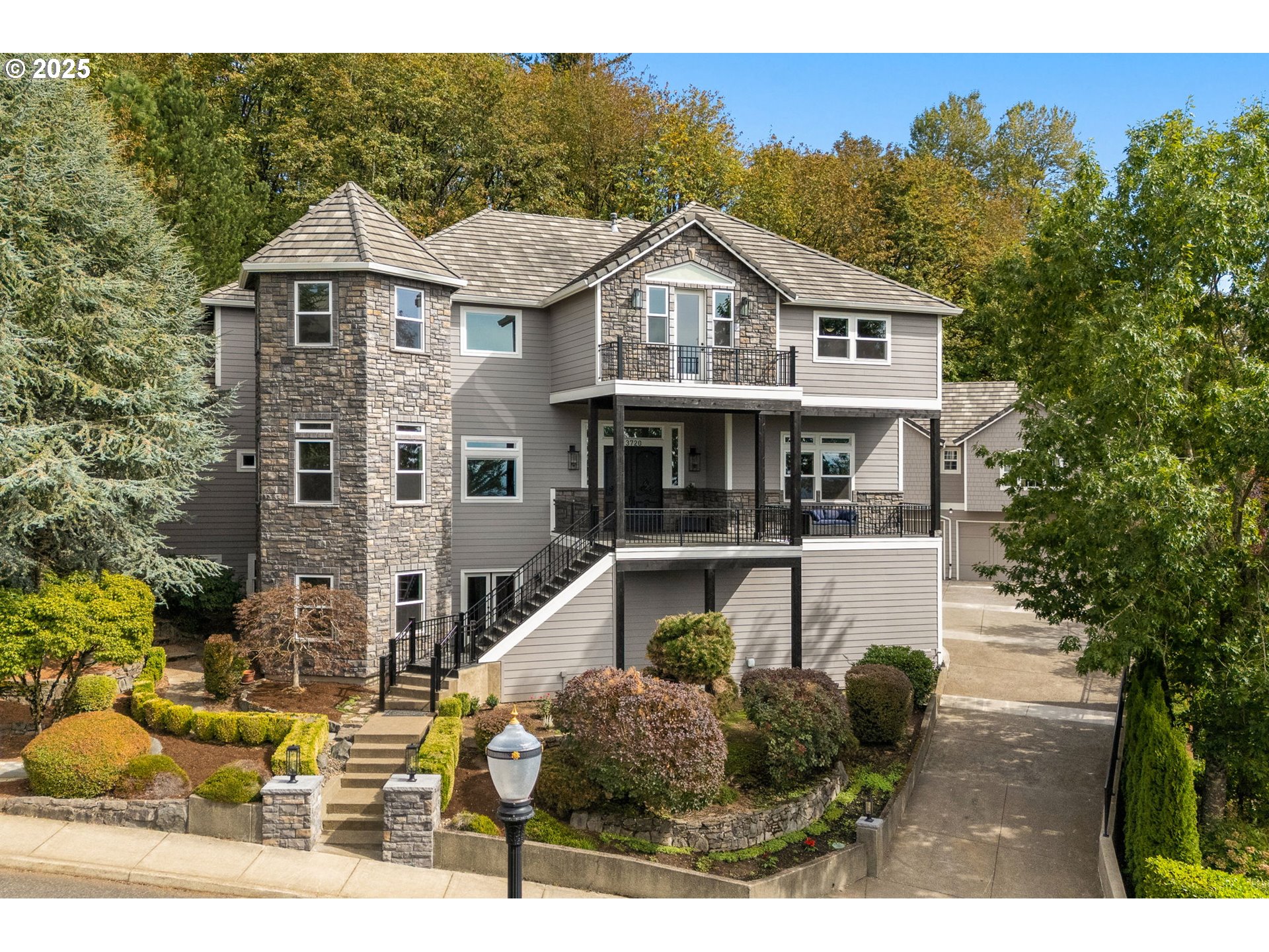 3720 Northwest Devoto Lane Portland, OR 97229 - Photo 1 of 44 a front view of a house with a yard and garage