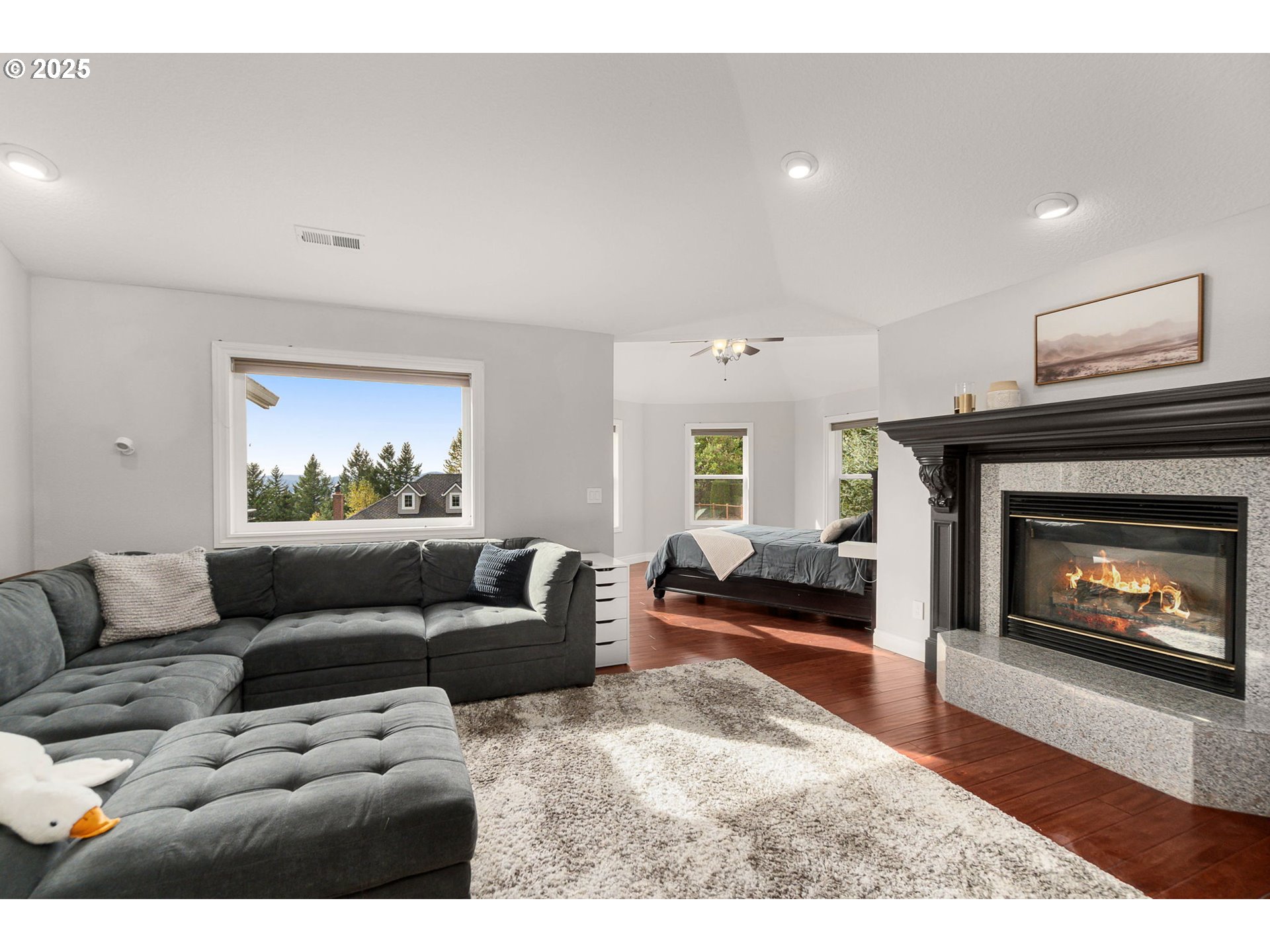 3720 Northwest Devoto Lane Portland, OR 97229 - Photo 15 of 44 a living room with furniture and a fireplace