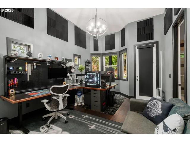 a living room with furniture a chandelier and a flat screen tv