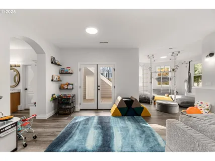 a bedroom with furniture and a wooden floor