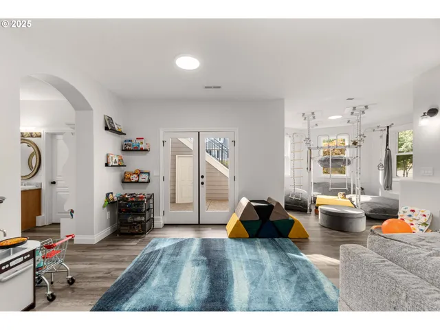 a bedroom with furniture and a wooden floor