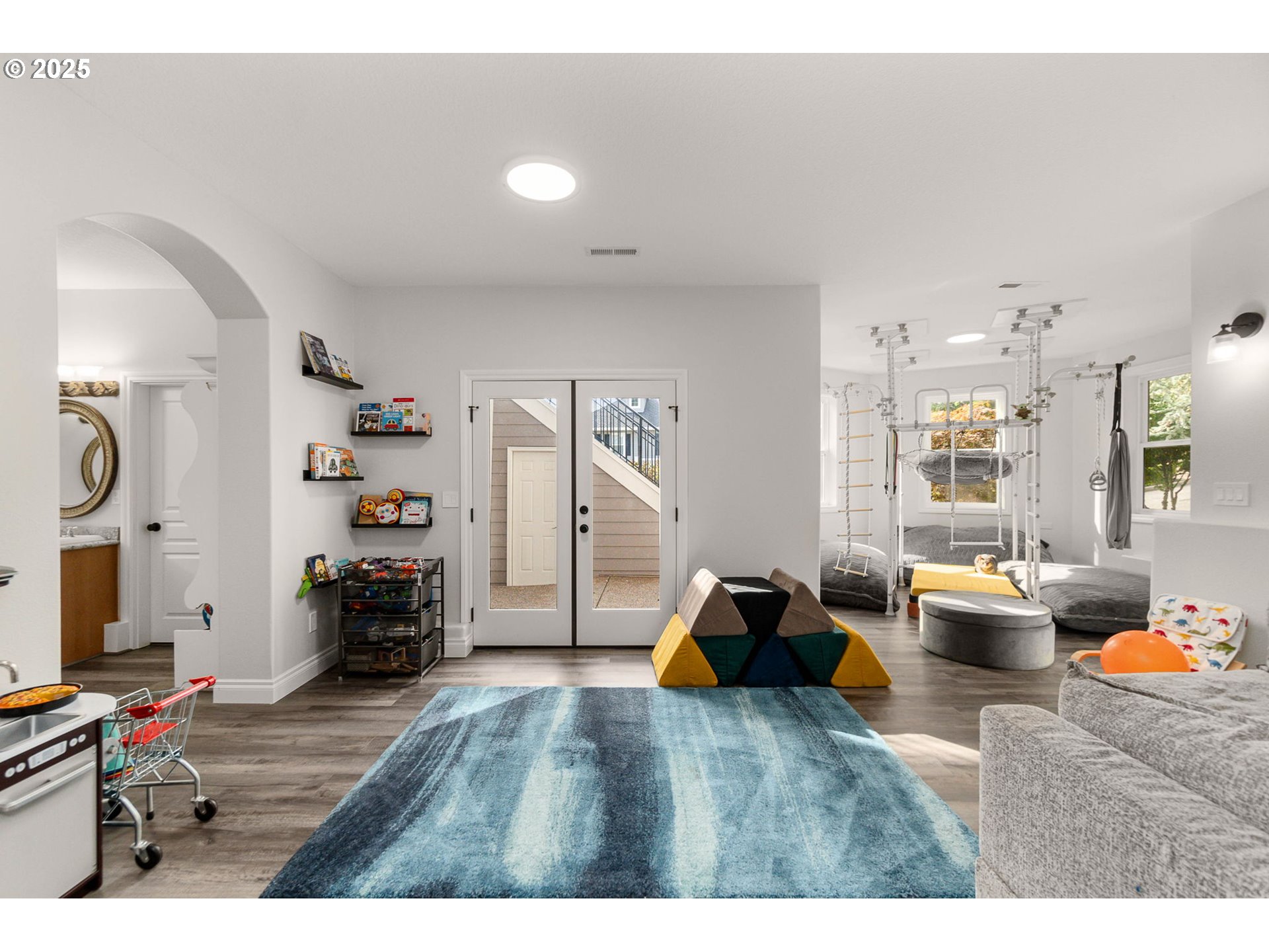 3720 Northwest Devoto Lane Portland, OR 97229 - Photo 28 of 44 a bedroom with furniture and a wooden floor