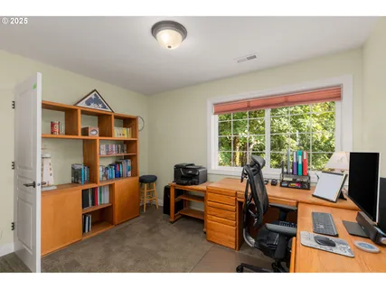 a workspace with furniture and a window