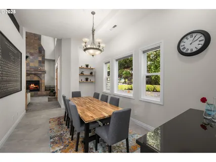 a view of a dining room with furniture and window