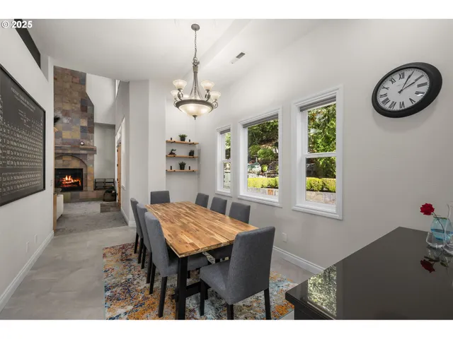 a view of a dining room with furniture and window