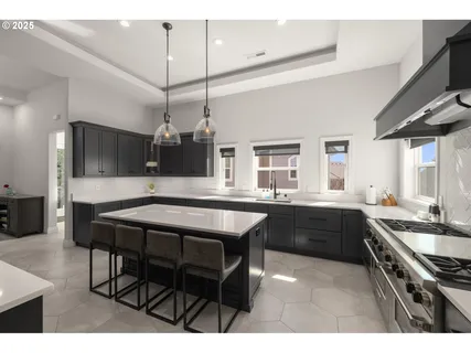 a kitchen with a table and chairs in it