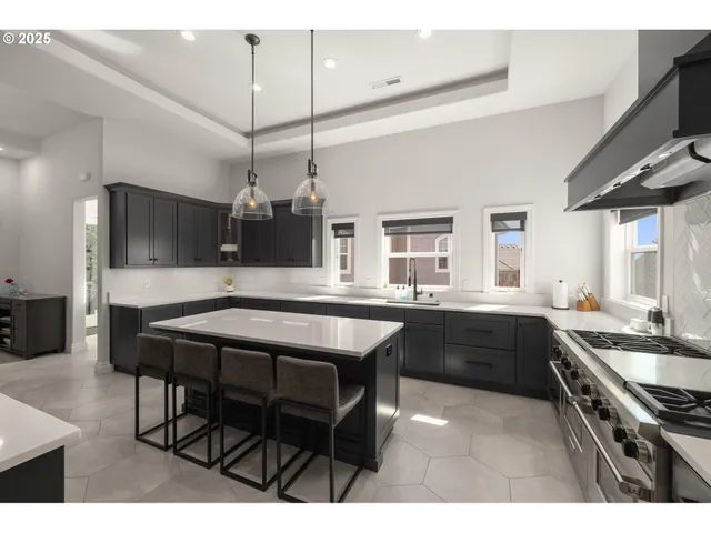 a kitchen with a table and chairs in it