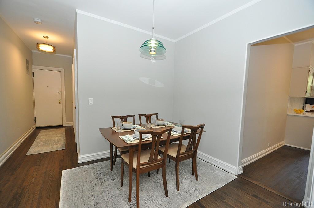 143 Garth Road, Unit 4P Scarsdale, NY 10583 - Photo 19 of 44 Updated Eat-In-Kitchen has Quartz counters and stainless steel appliances.