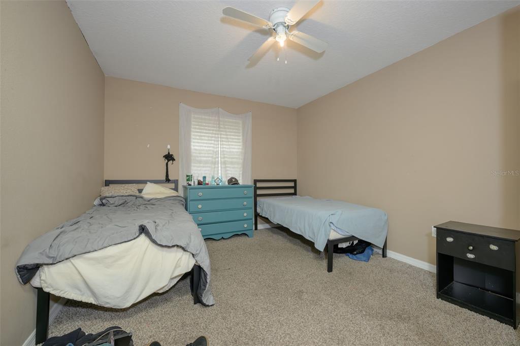 11 Riddle Drive Palm Coast, FL 32164 - Photo 20 of 33 a living room with furniture and a chandelier