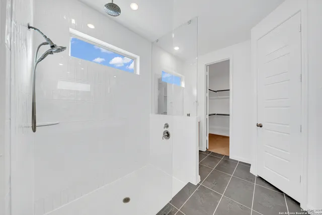 a bathroom with a bathtub and a shower