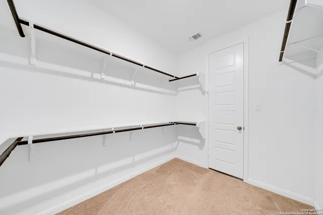 a view of an empty walk in closet
