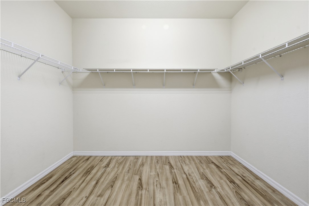 14951 Reflection Key Circle, Unit 536 Fort Myers, FL 33907 - Photo 16 of 36 a view of an empty walk in closet