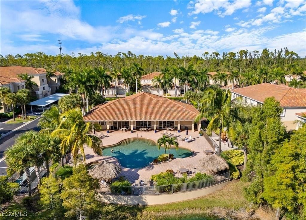 14951 Reflection Key Circle, Unit 536 Fort Myers, FL 33907 - Photo 27 of 36 a view of a house with a yard and garden