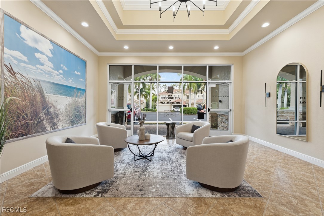 14951 Reflection Key Circle, Unit 536 Fort Myers, FL 33907 - Photo 28 of 36 a living room with furniture and a potted plant