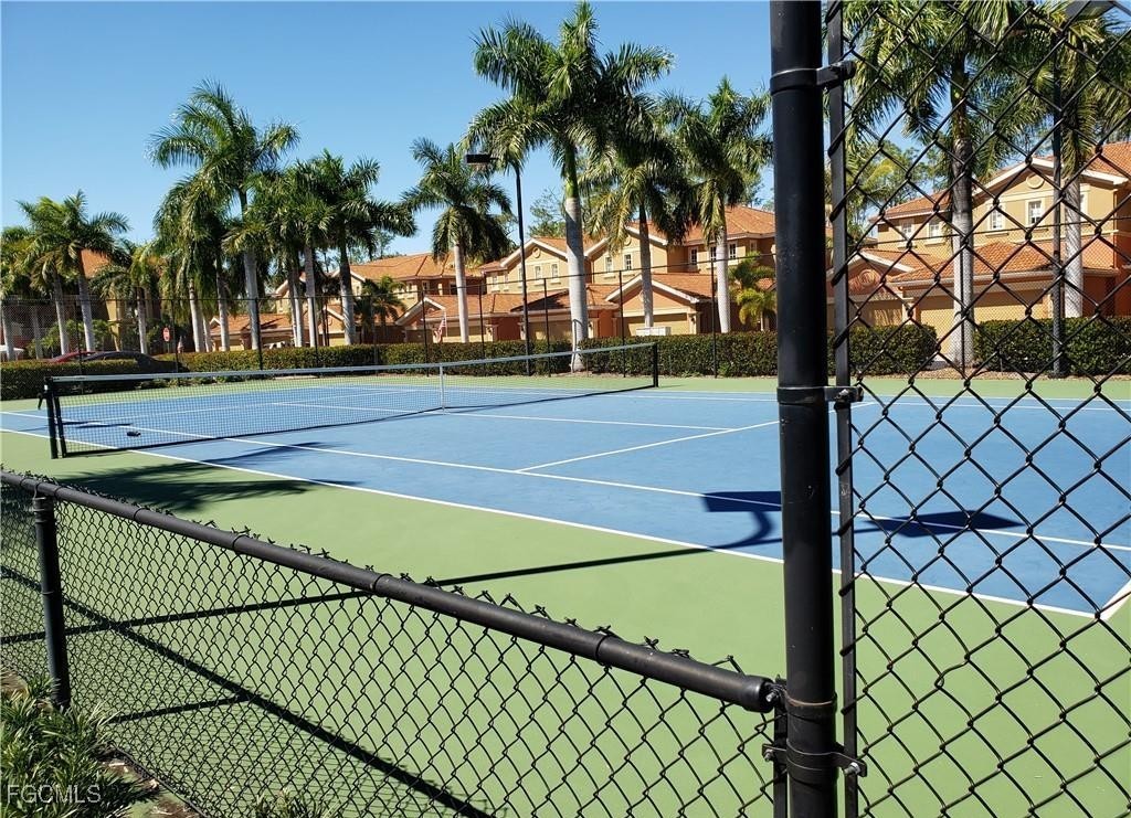 14951 Reflection Key Circle, Unit 536 Fort Myers, FL 33907 - Photo 33 of 36 a view of a tennis court