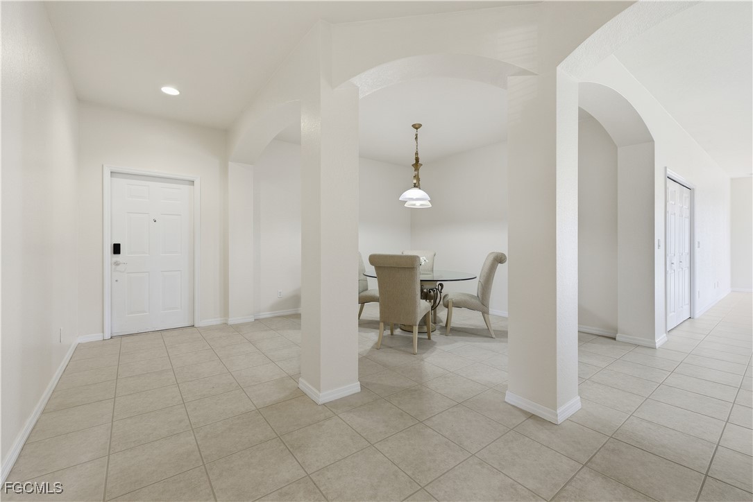 14951 Reflection Key Circle, Unit 536 Fort Myers, FL 33907 - Photo 4 of 36 a view of a room with table and chair