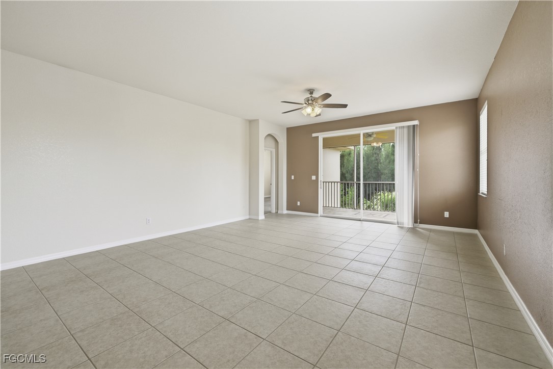 14951 Reflection Key Circle, Unit 536 Fort Myers, FL 33907 - Photo 9 of 36 a view of an empty room with a window