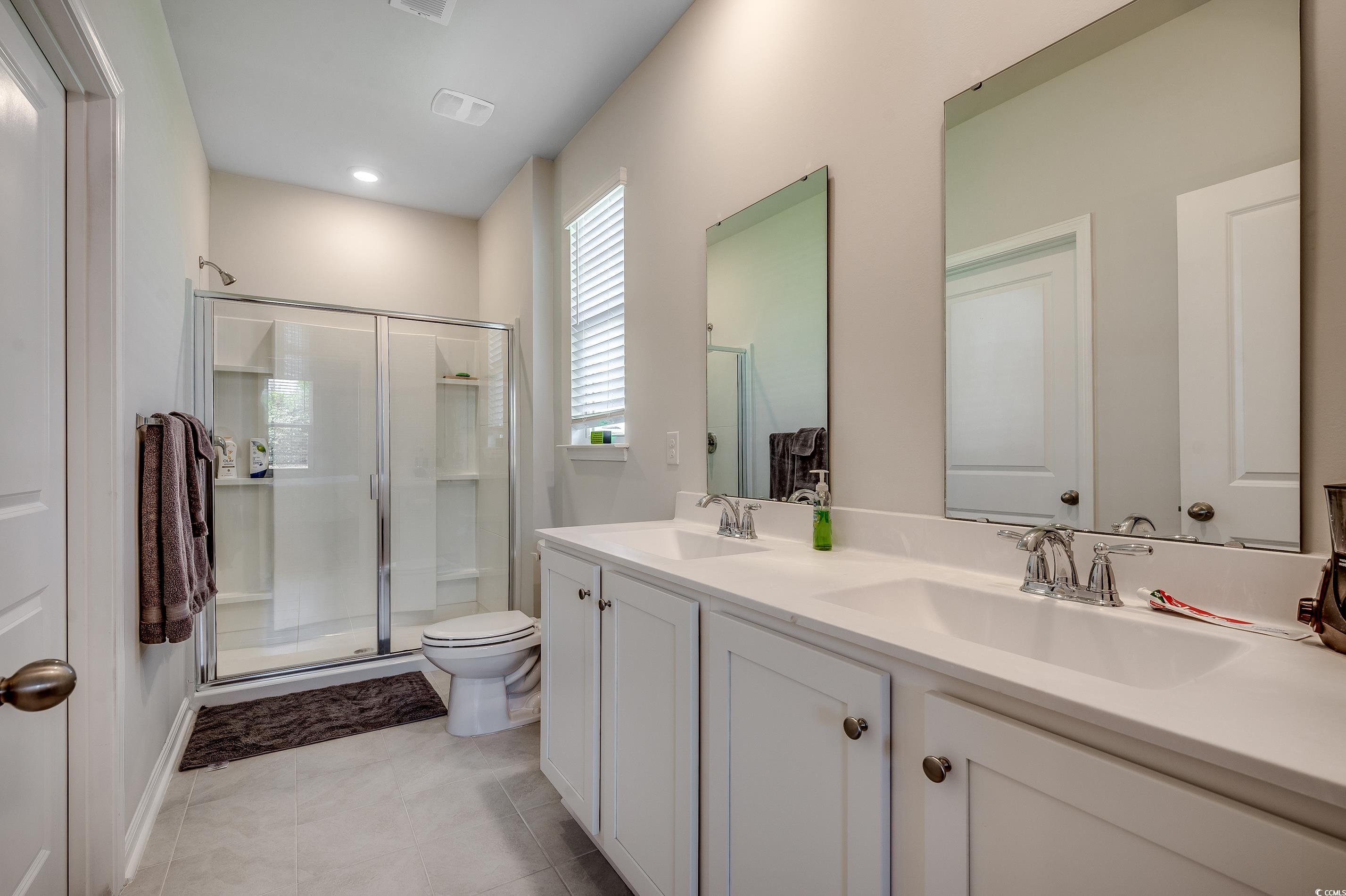 2924 Skylar Drive Myrtle Beach, SC 29577 - Photo 15 of 30 Bathroom with a shower stall and double vanity