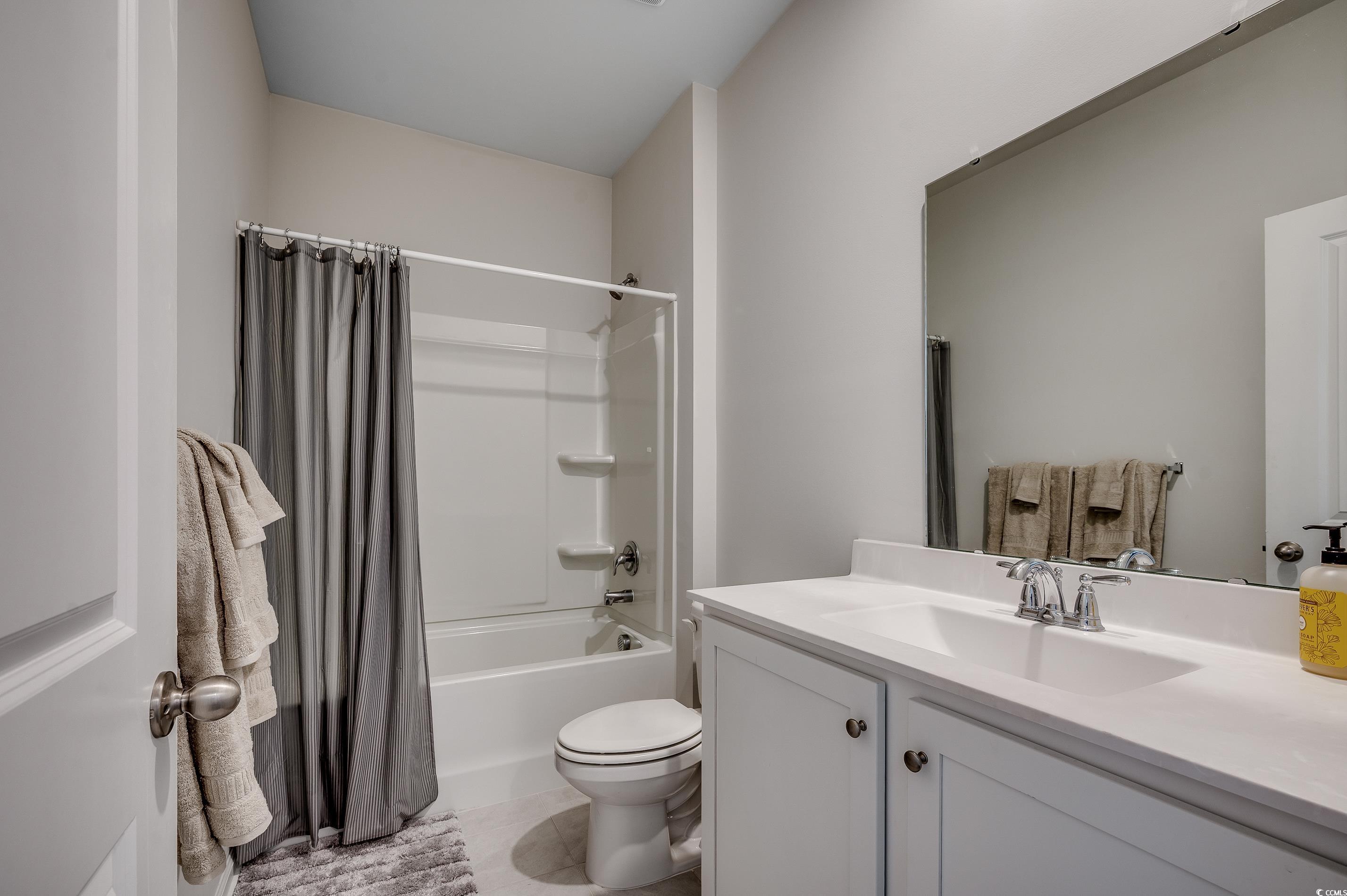 2924 Skylar Drive Myrtle Beach, SC 29577 - Photo 18 of 30 Bathroom featuring vanity, shower / bath combo, and tile patterned floors