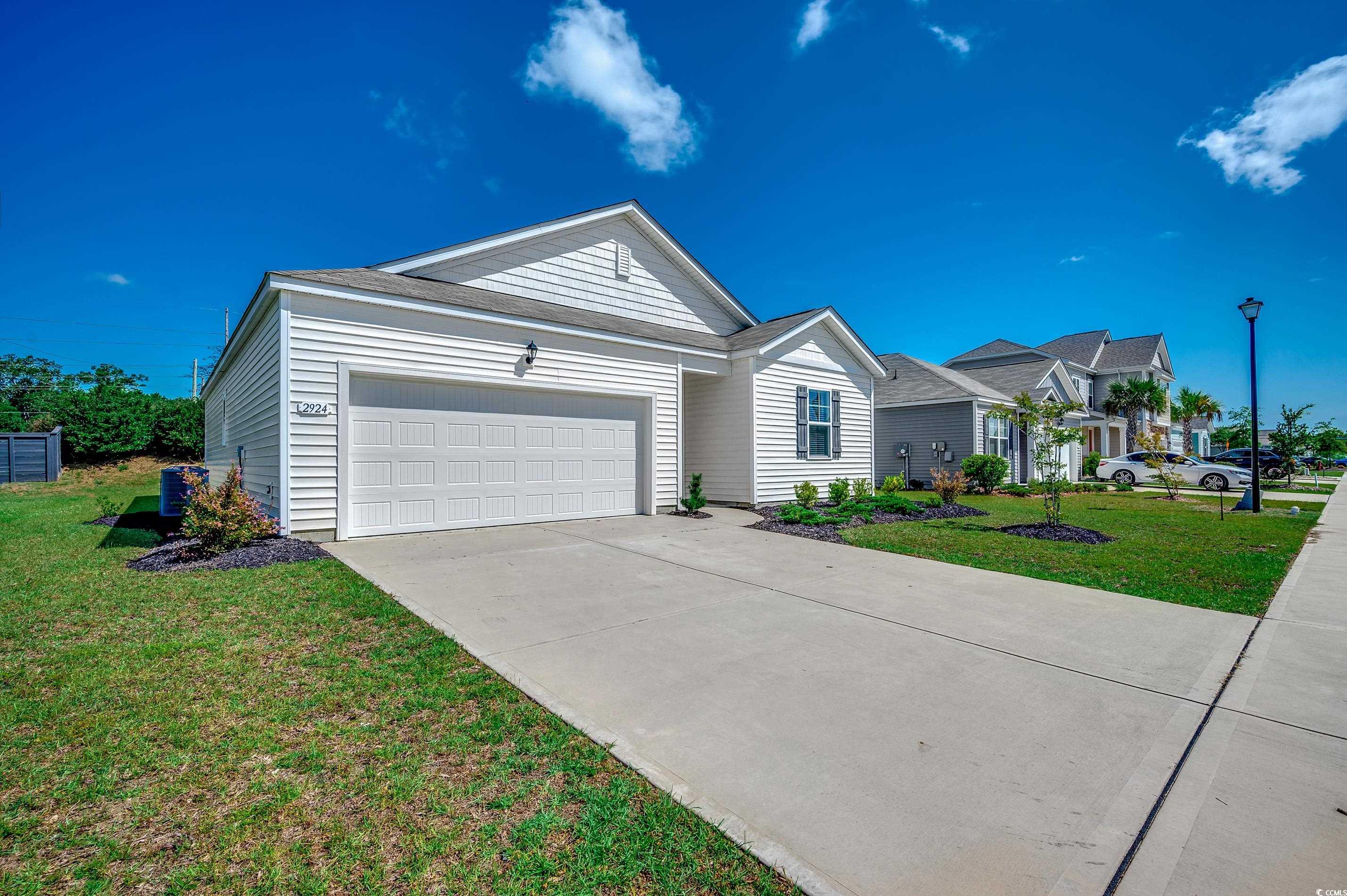 2924 Skylar Drive Myrtle Beach, SC 29577 - Photo 2 of 30 Ranch-style home featuring a garage, driveway, and a front lawn