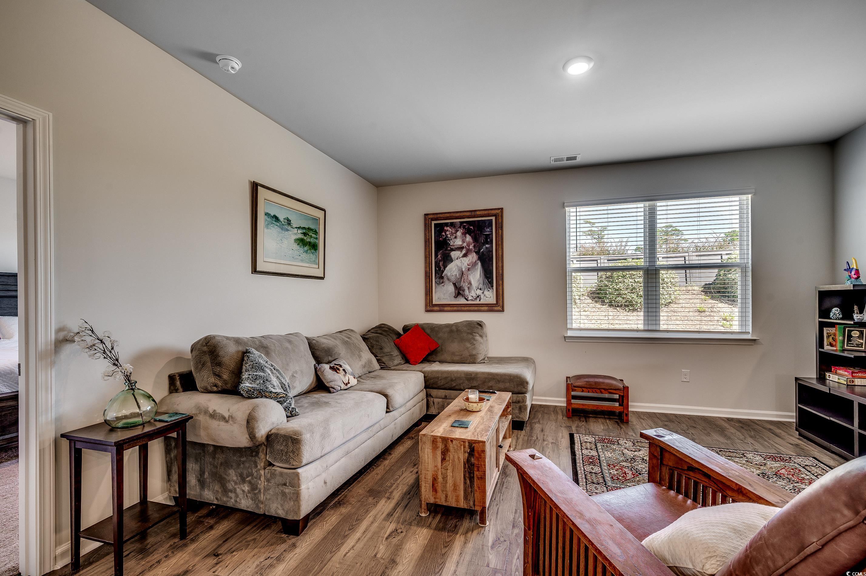 2924 Skylar Drive Myrtle Beach, SC 29577 - Photo 7 of 30 Living area with wood finished floors and baseboards