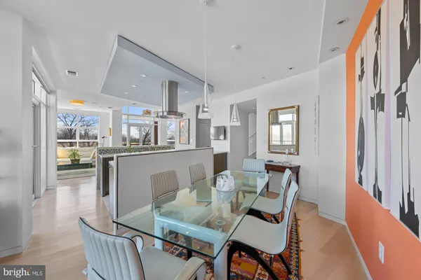 an open kitchen with granite countertop a sink stove and cabinets