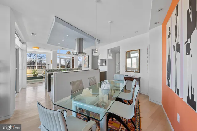 an open kitchen with granite countertop a sink stove and cabinets