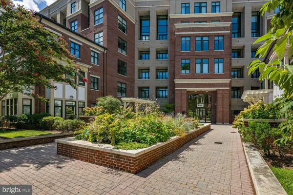 a front view of a building with garden