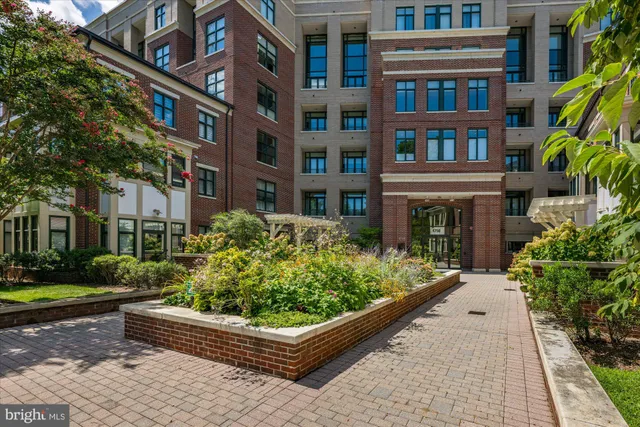 a front view of a building with garden