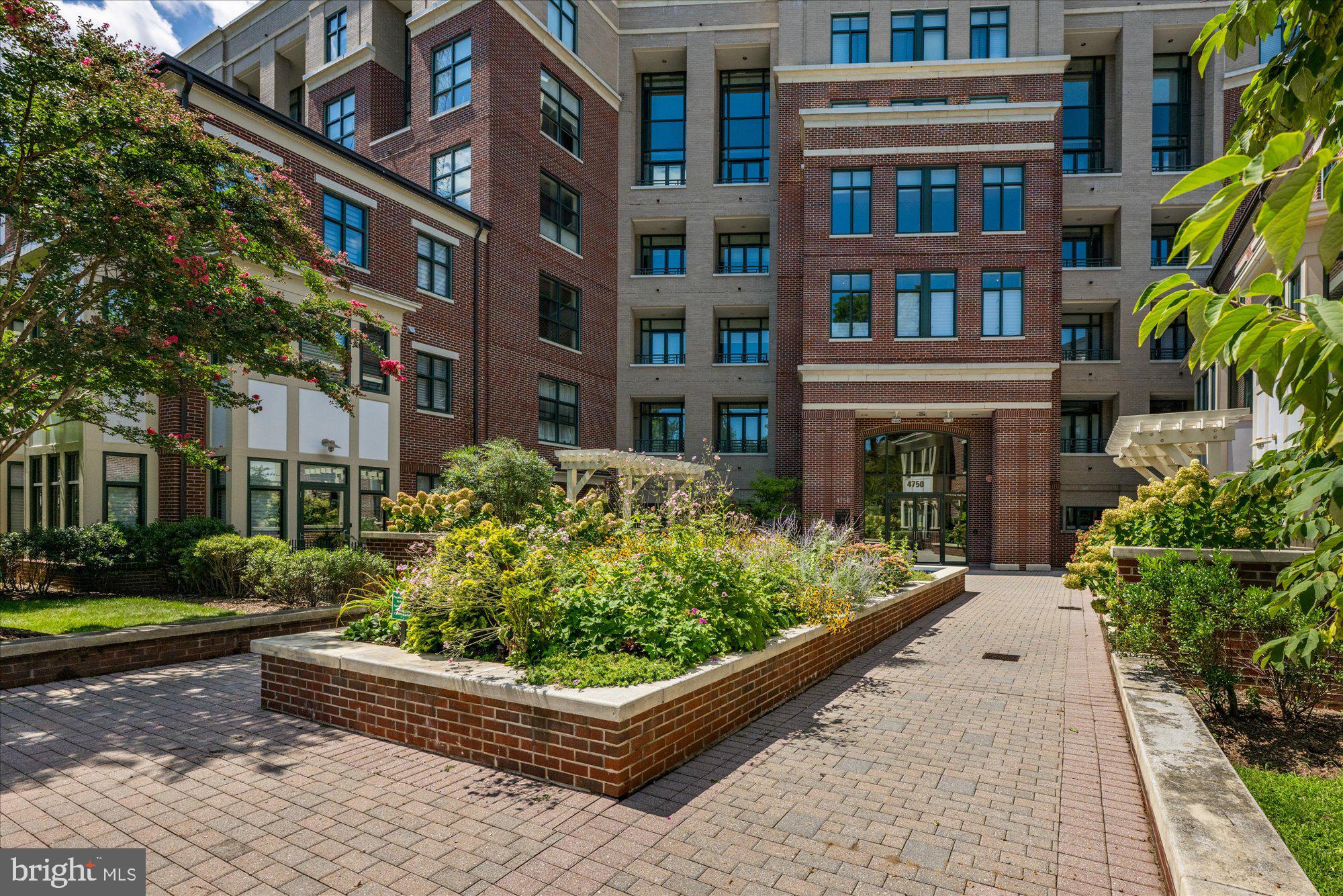 4750 41st Street Northwest, Unit 507 Washington, DC 20016 - Photo 2 of 50 a front view of a building with garden
